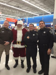 Al volunteers for “Shop With A Cop at a local Walmart for needing children”