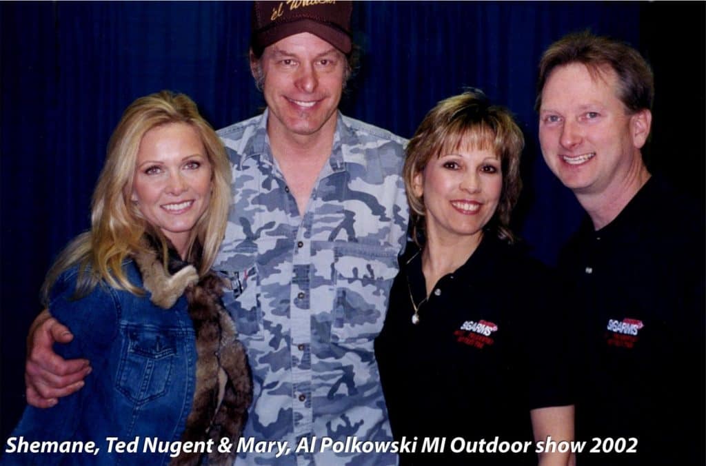 Ted Nugent with Sheman at the Michigan Outdoor Show in 2002 with Mary and Al Polkowski