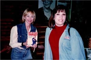 Author of ‘Not An Easy Target’ & ‘Trainer of the Stars’ (such as Geena Davis/AKA: Thelma & Louise Fame), presents Mary with an autographed copy of her book after a Celebrity Firearm Session in 1996