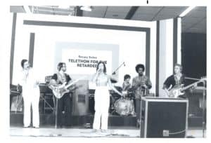 Mary performs with her recording Group ‘Odyssey’ during a live broadcast for Television Channel 20 for Celebrity Telethon Benefit: 1977