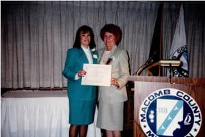 Mary being presented the prestigious 100+ hours of volunteer service to her community by Macomb Co. Commissioner Joan Flynn